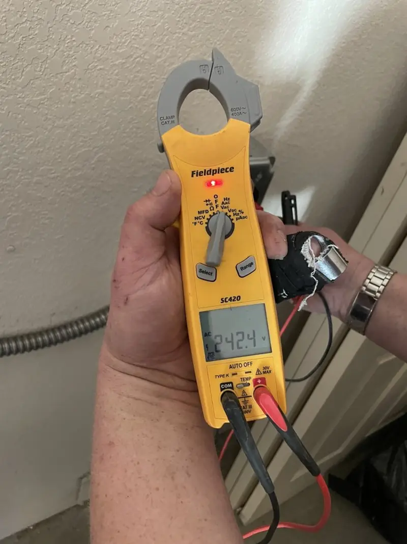 Voltage testing with clamp meter during Recessed Lighting Installation in Maricopa